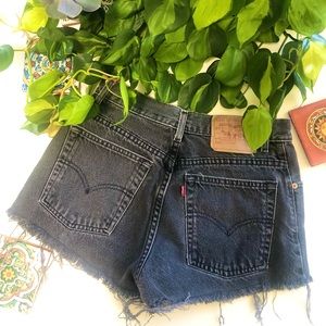 Super cute black cut off Levi shorts. Size 6.